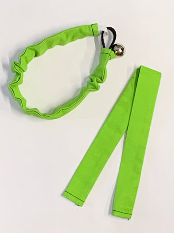 A green Kitty Holster Collar Cover (Made in USA) fabric hair tie with a ruffled elastic band and a small bell, alongside a pair of green hair ribbons.