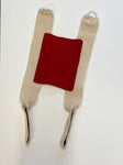 A pair of red and white Birdy Bra Crop Supporter chest protector straps on a white surface.