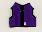 A comfortable purple Bunny Holster Rabbit Harness with black straps.