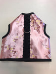 A Custom Boutique Kitty Holster Cat Harness in pink and black with a floral pattern and comfortable fabric.
