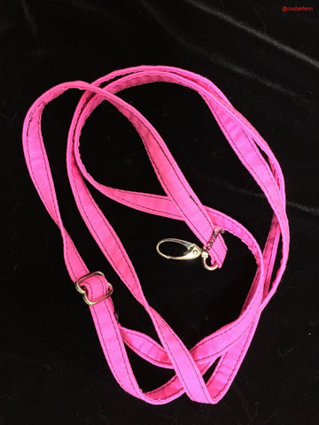 A pink leather Clearance Holster Leash (Made in USA) on a black background.